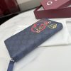 Interlocking double G and stirrup prints embellish various small leather items, showcasing festive colors. This pattern is eye-catching and embellished on this fully zippered wallet made of soft GG Supreme
