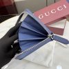 Interlocking double G and stirrup prints embellish various small leather items, showcasing festive colors. This pattern is eye-catching and embellished on this fully zippered wallet made of soft GG Supreme
